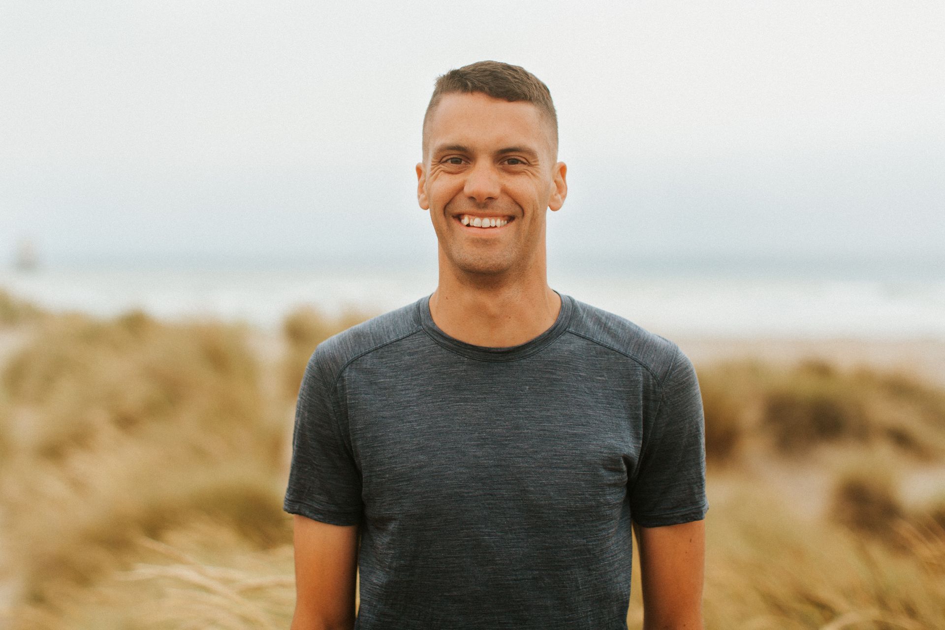 Justin standing on beach